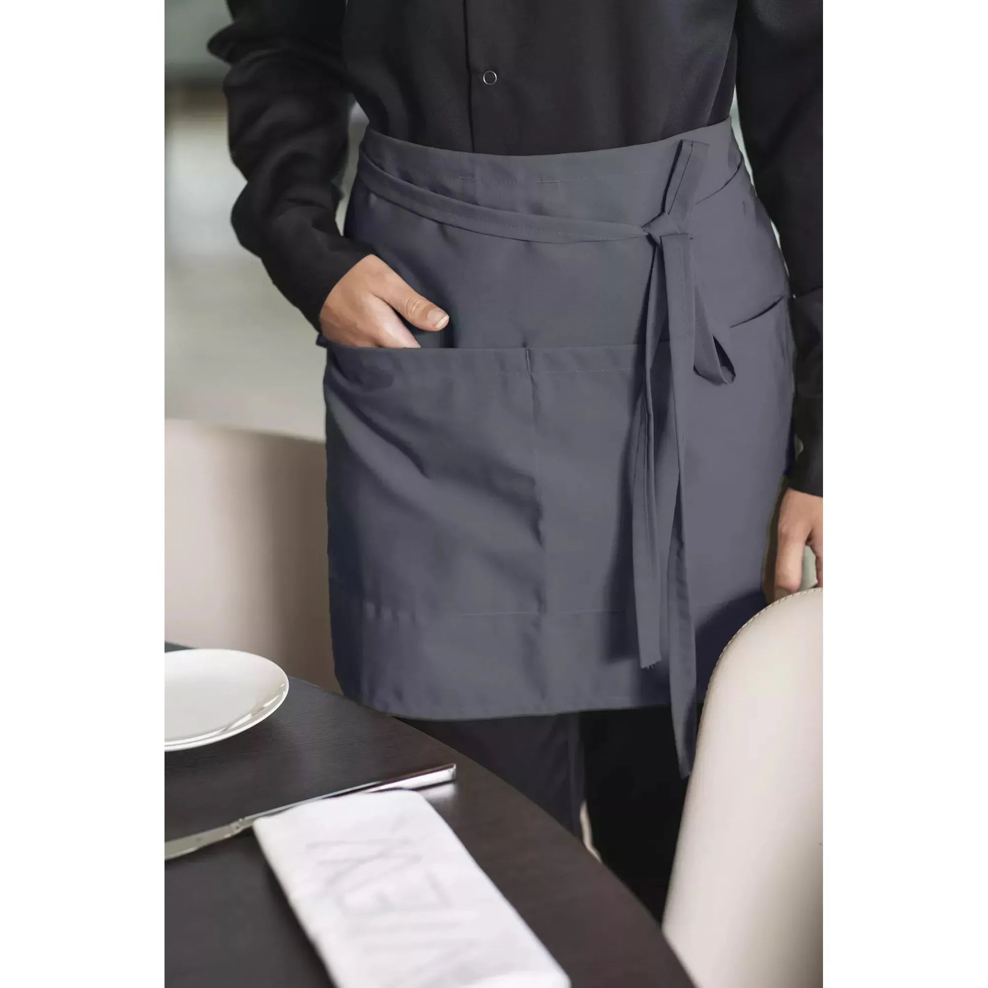 Gray food service waist apron with pockets on a waitress