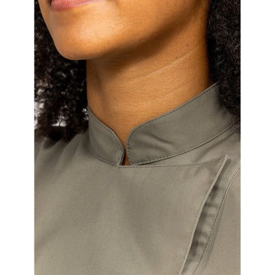 Close-up of a person wearing an Olivette chef's coat with a collar.
