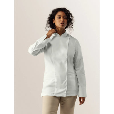 Woman wearing a light gray long-sleeve LNC Chef coat against a plain background