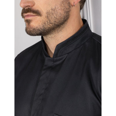 Close-up of a person wearing a black Falco, showing the collar detail.