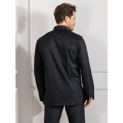 Man wearing a black Falco cooking coat standing with his back towards the camera, so you can see the subtle details