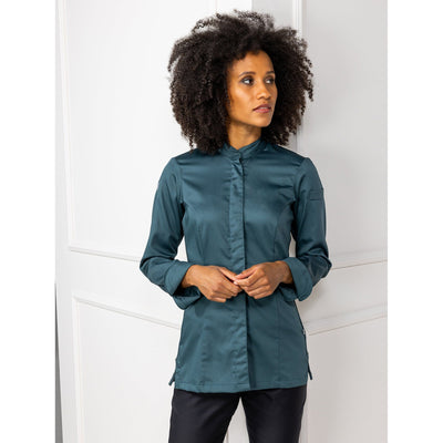 Woman wearing a fashion color chef's coat with hidden closure, long sleeves. Elegant, comfortable kitchen jacket by Le Nouveau Chef.