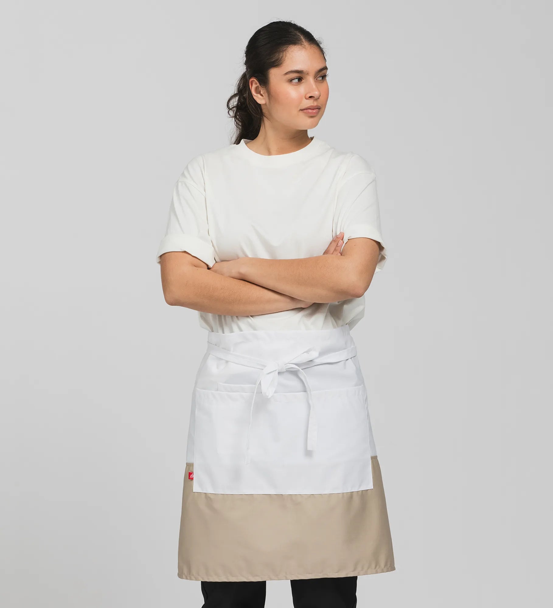 Head waitress wearing a 2 tone apron. White and tan