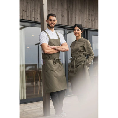 A team of a waiter and waitresses in service aprons
