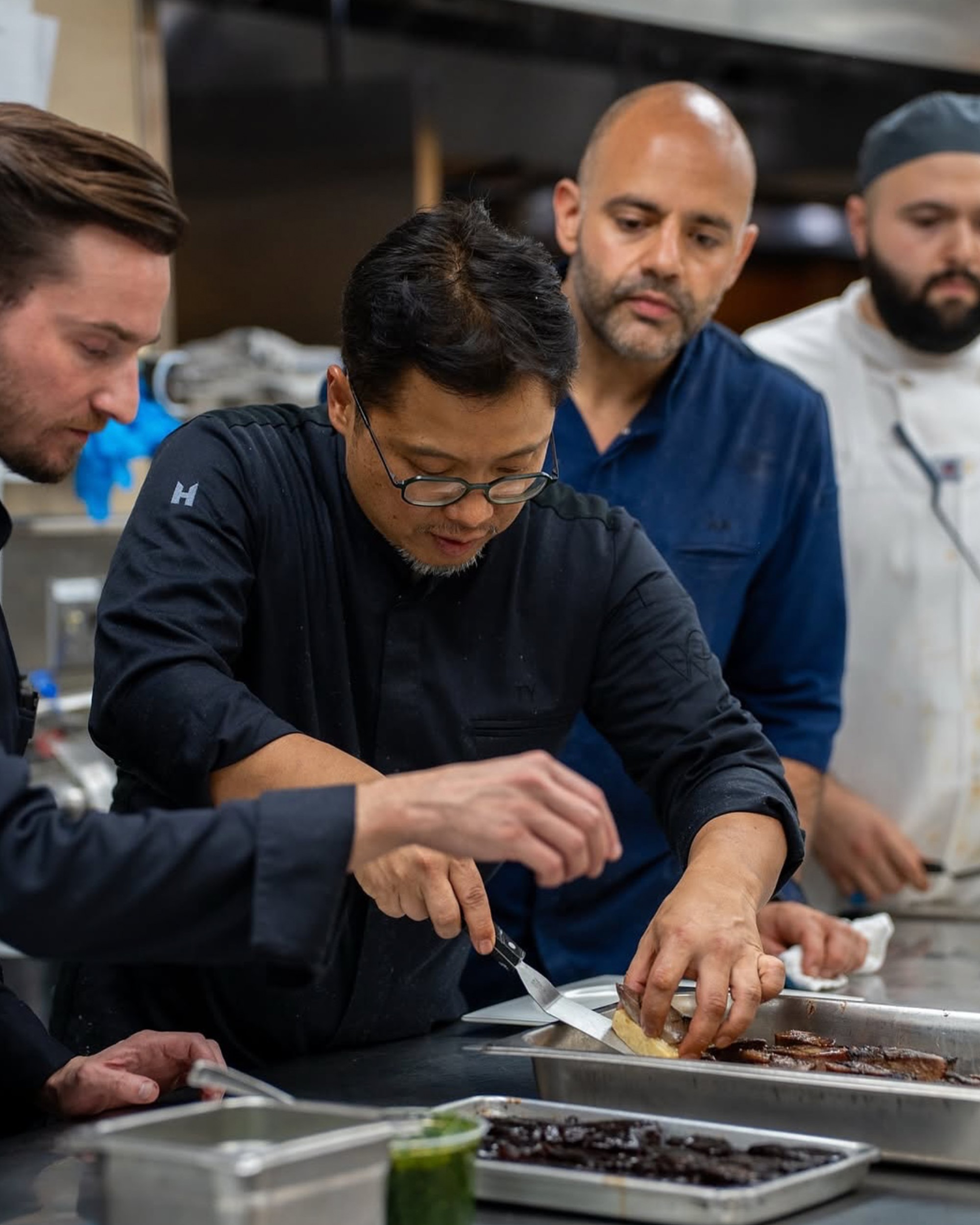 Hotel chef brigade in matching European chef coats