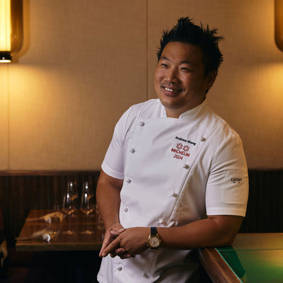 Michelin rated chef standing in a restaurant wearing a Lafont Short sleeve double breasted chef jacket 