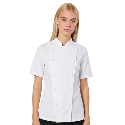 Woman wearing a white short sleeve double breasted chef's coat on a white background