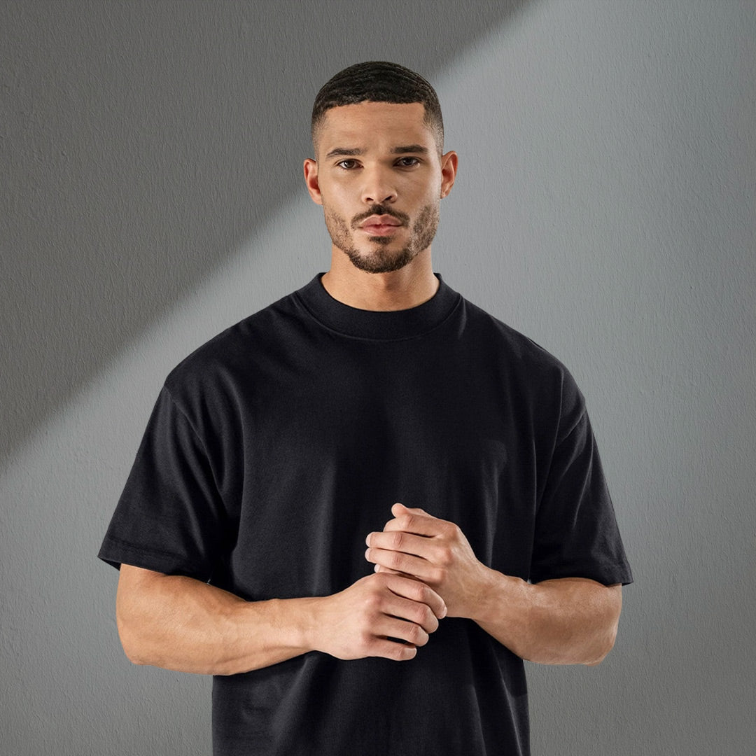 Professional waiter standing confidently in the ultimate comfort, black T-shirt by LNC